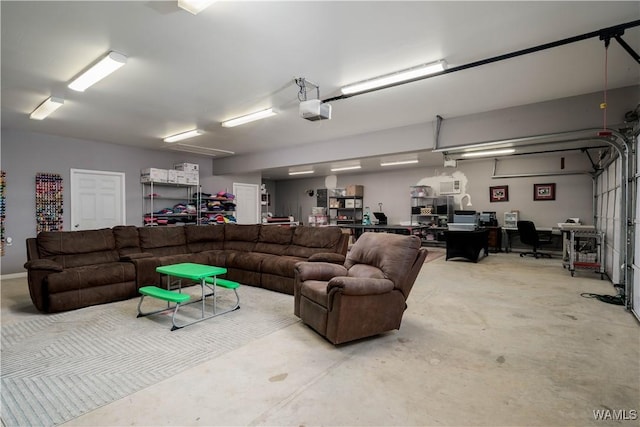 living room featuring concrete flooring and a garage