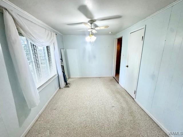 1511 Service St, Demopolis, AL 36732 - spare room with carpet, ceiling fan, crown molding, and baseboards