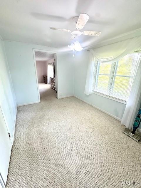 1511 Service St, Demopolis, AL 36732 - carpeted spare room featuring baseboards and a ceiling fan