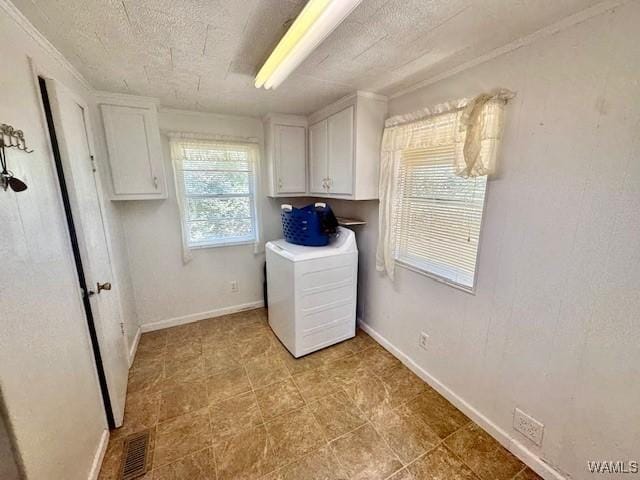 1511 Service St, Demopolis, AL 36732 - laundry area with washer / clothes dryer, cabinet space, baseboards, a textured ceiling, and ornamental molding