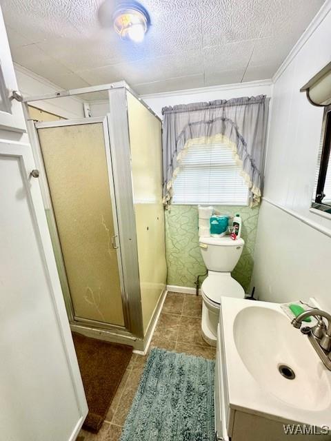 1511 Service St, Demopolis, AL 36732 - bathroom featuring a stall shower, toilet, vanity, crown molding, and tile patterned floors