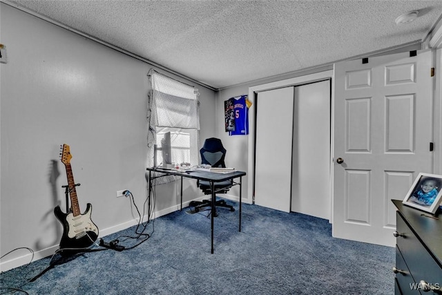 carpeted office featuring a textured ceiling and baseboards