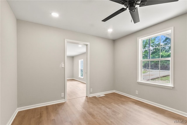 unfurnished room featuring ceiling fan and light hardwood / wood-style flooring