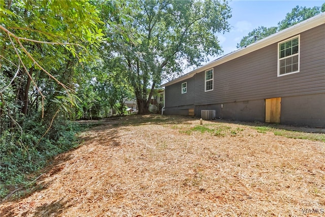 view of yard with central AC