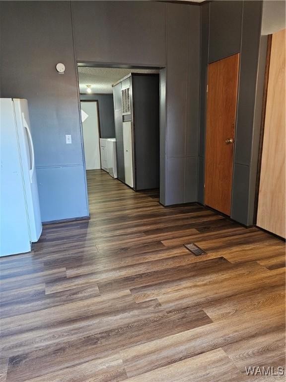 empty room featuring dark wood-type flooring