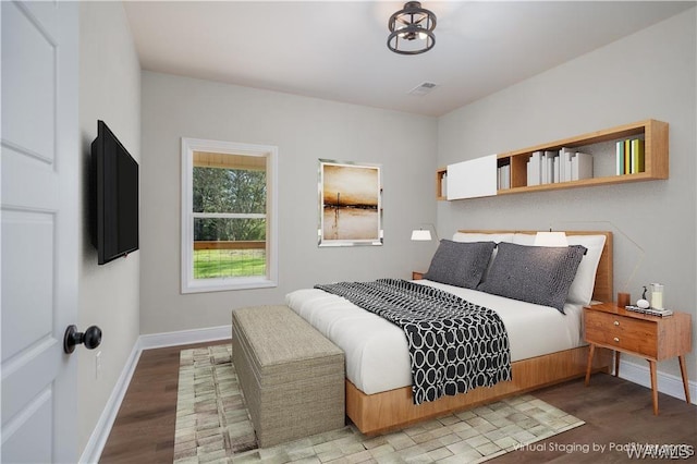 bedroom featuring wood-type flooring