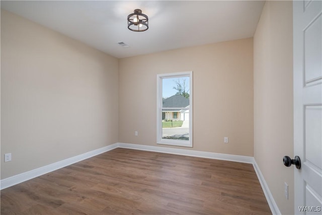 empty room featuring hardwood / wood-style floors