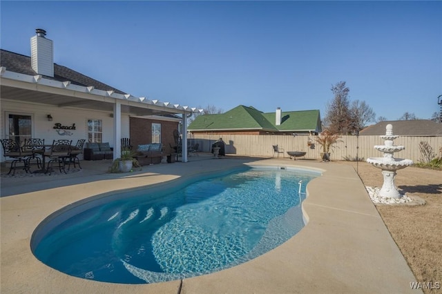 view of swimming pool featuring an outdoor living space and a patio area