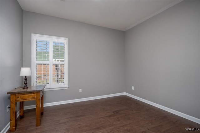 spare room featuring dark hardwood / wood-style floors