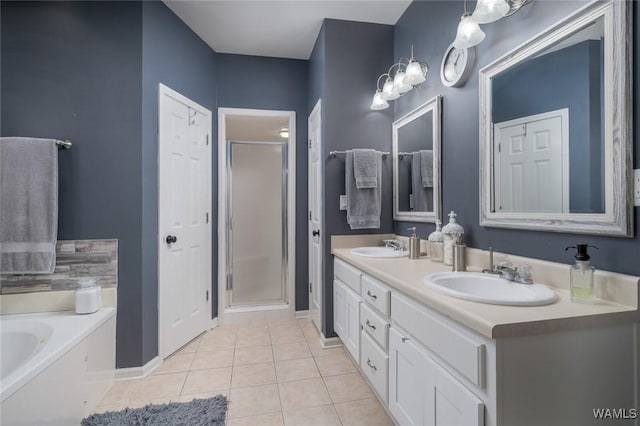 bathroom with tile patterned flooring, vanity, and plus walk in shower