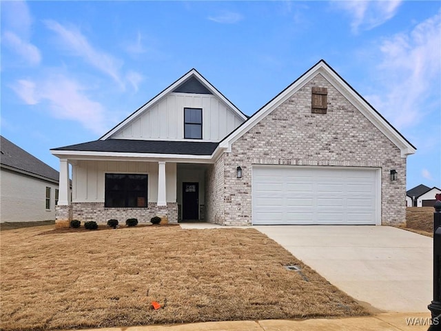 view of front of house with a garage and a front lawn