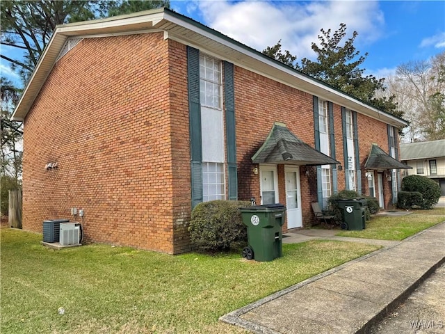 view of property exterior with a lawn