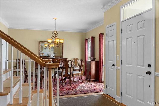 dining space featuring a notable chandelier and ornamental molding