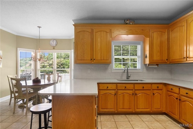 kitchen featuring pendant lighting, a chandelier, tasteful backsplash, light tile patterned flooring, and sink