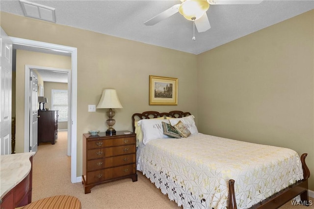 bedroom featuring ceiling fan and light carpet