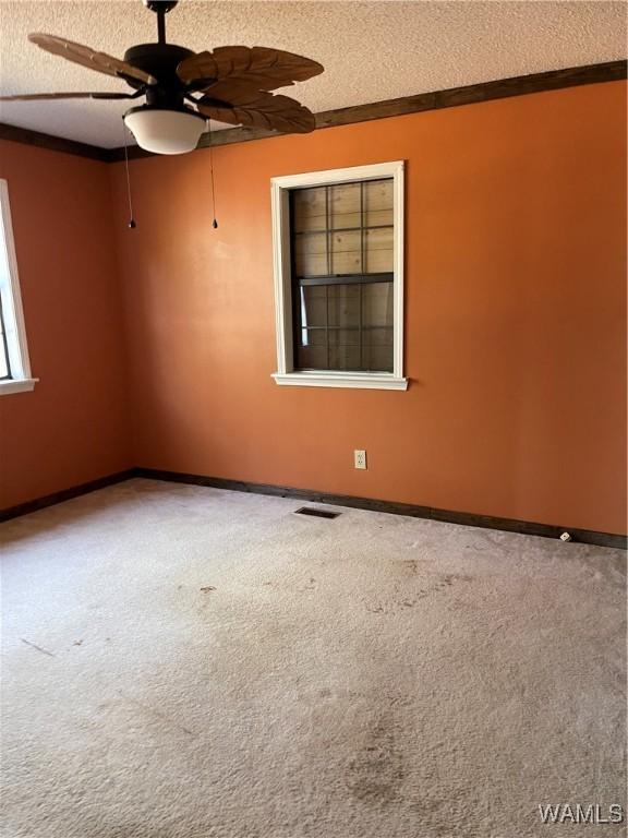 empty room with dark hardwood / wood-style floors and ceiling fan