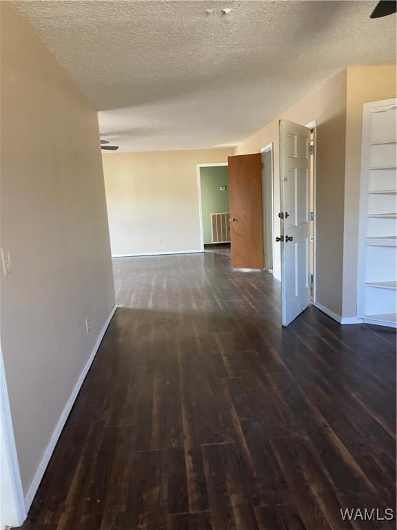 interior space with ceiling fan and wood walls