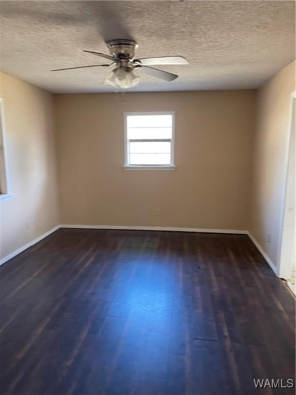 interior space with light carpet, ceiling fan, beam ceiling, built in desk, and wood walls