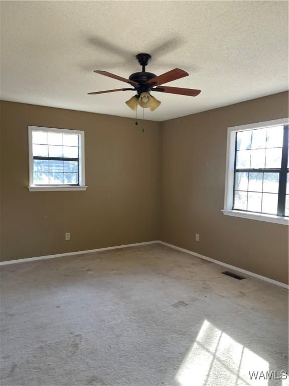 interior space featuring wooden walls and ceiling fan