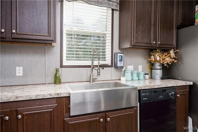 kitchen featuring sink, dark brown cabinets, and black dishwasher