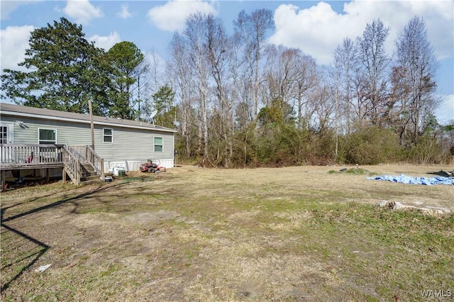 view of yard featuring a wooden deck