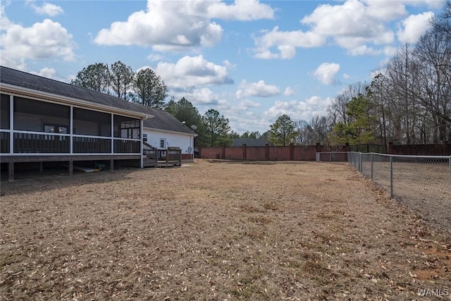 view of yard with a sunroom