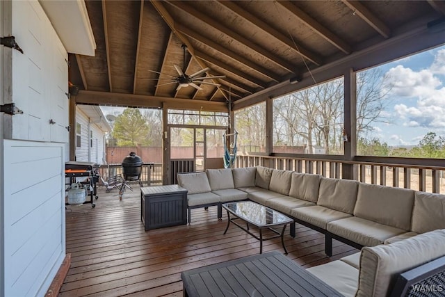 sunroom / solarium with wood ceiling, ceiling fan, and vaulted ceiling with beams