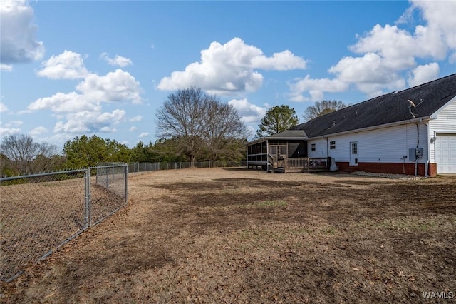 view of yard featuring a sunroom