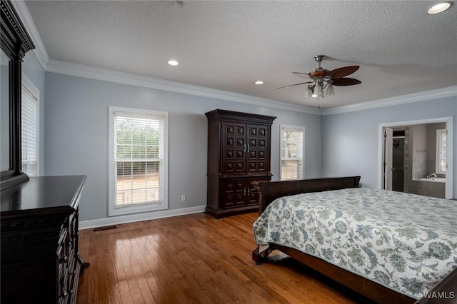 bedroom with ensuite bathroom, a textured ceiling, ornamental molding, ceiling fan, and hardwood / wood-style floors