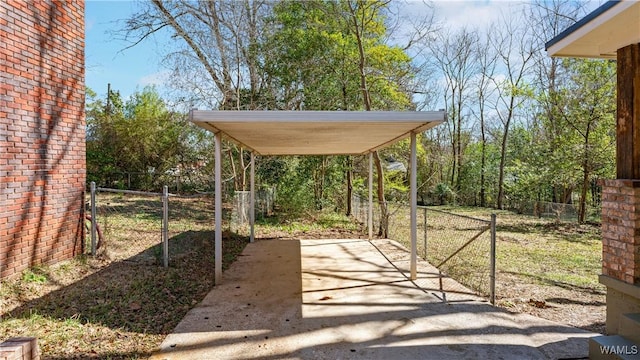 exterior space with driveway and fence