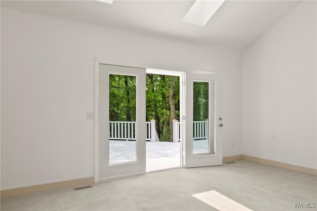 6803 Emerald Ln, Tuscaloosa, AL 35406 - spare room with carpet flooring, a skylight, and baseboards