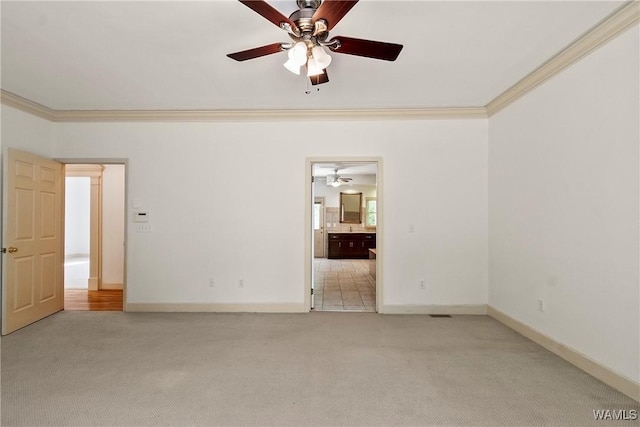 6803 Emerald Ln, Tuscaloosa, AL 35406 - empty room with a ceiling fan, light colored carpet, crown molding, and baseboards