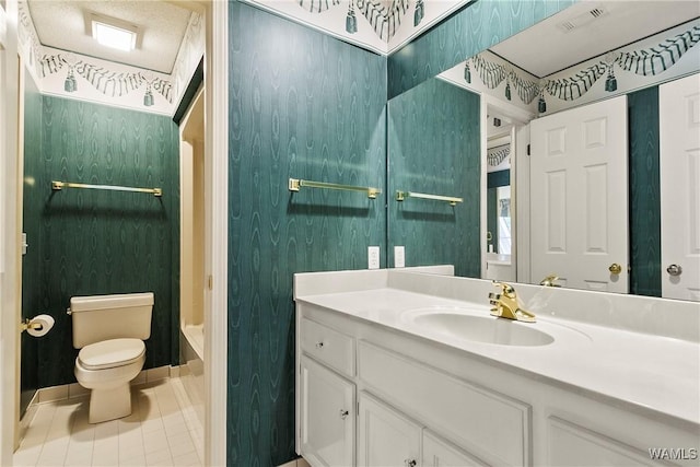 6803 Emerald Ln, Tuscaloosa, AL 35406 - bathroom with vanity, toilet, tile patterned flooring, and tub / shower combination