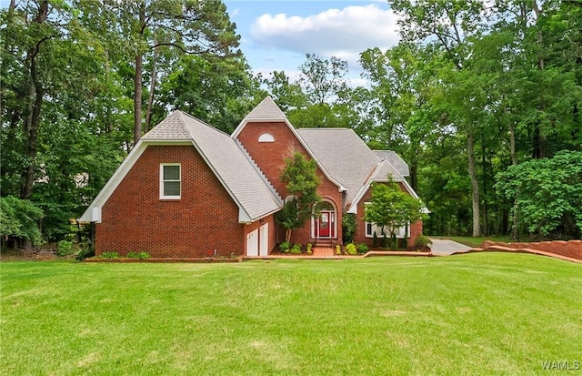 6803 Emerald Ln, Tuscaloosa, AL 35406 - view of front of house with a front lawn and a shingled roof