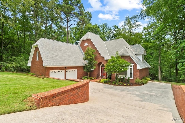 6803 Emerald Ln, Tuscaloosa, AL 35406 - traditional home featuring a front lawn, concrete driveway, a garage, and a shingled roof