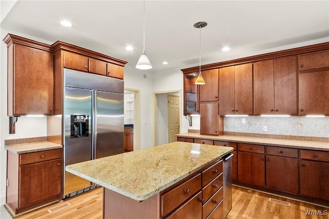 6803 Emerald Ln, Tuscaloosa, AL 35406 - kitchen featuring built in fridge, light wood finished floors, backsplash, decorative light fixtures, and recessed lighting