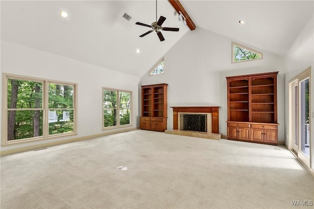 6803 Emerald Ln, Tuscaloosa, AL 35406 - unfurnished living room featuring high vaulted ceiling, beamed ceiling, a tiled fireplace, carpet floors, and a ceiling fan