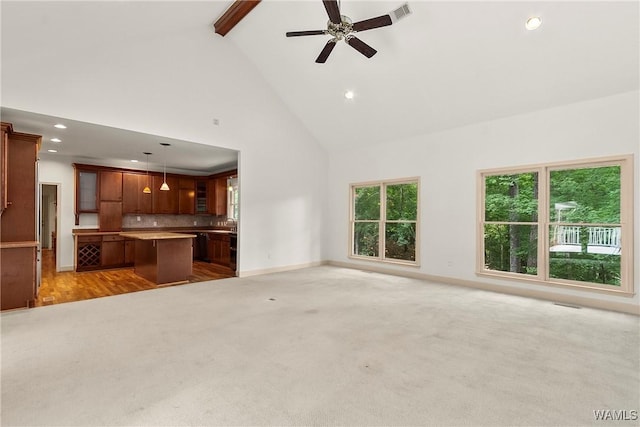 6803 Emerald Ln, Tuscaloosa, AL 35406 - unfurnished living room featuring high vaulted ceiling, light colored carpet, beam ceiling, baseboards, and recessed lighting