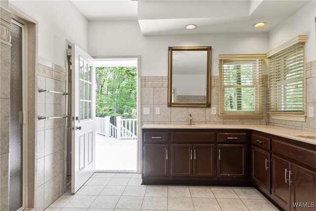 6803 Emerald Ln, Tuscaloosa, AL 35406 - full bath with double vanity, tile patterned flooring, recessed lighting, and decorative backsplash