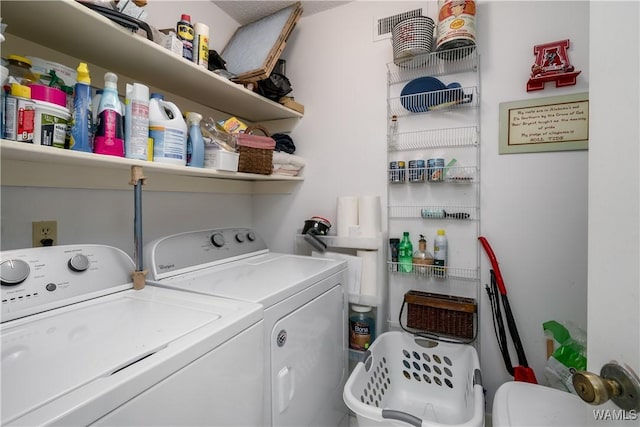 laundry area with laundry area and separate washer and dryer