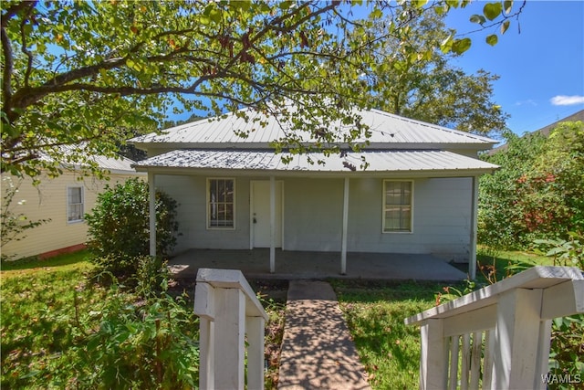 bungalow-style home featuring a patio