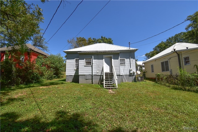 back of house with a yard