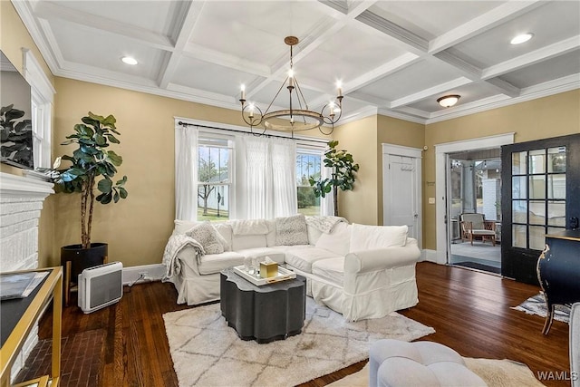 living area featuring coffered ceiling, baseboards, and wood finished floors