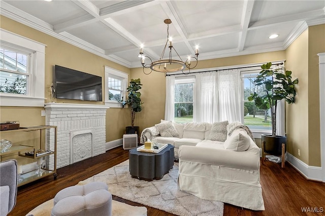 living area with plenty of natural light, baseboards, and wood finished floors