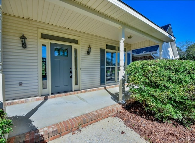 property entrance with covered porch