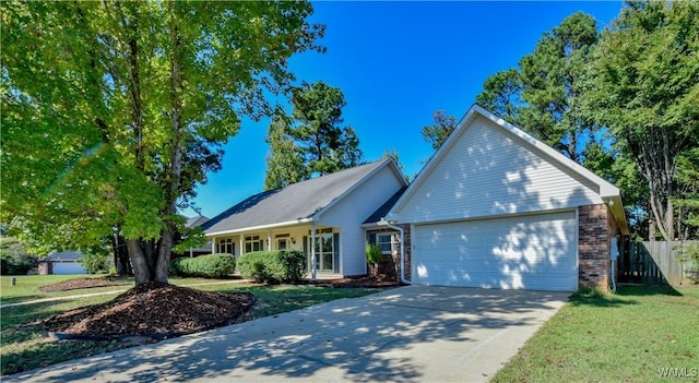 view of front of property featuring a front yard and a garage