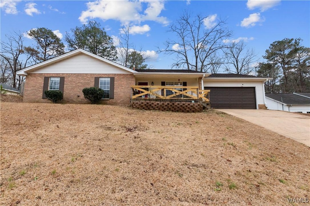 ranch-style home with a front lawn and a garage