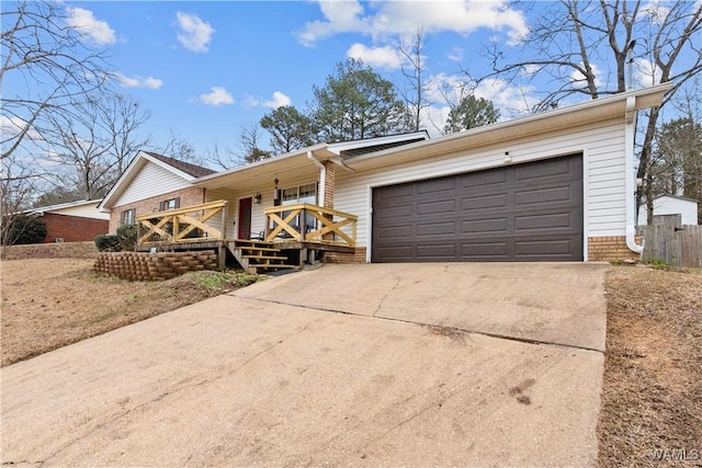 ranch-style home featuring a garage and a porch