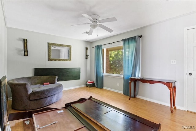 7665 Baptist Campground Rd, Northport, AL 35473 - living area featuring wood finished floors, visible vents, baseboards, and ceiling fan