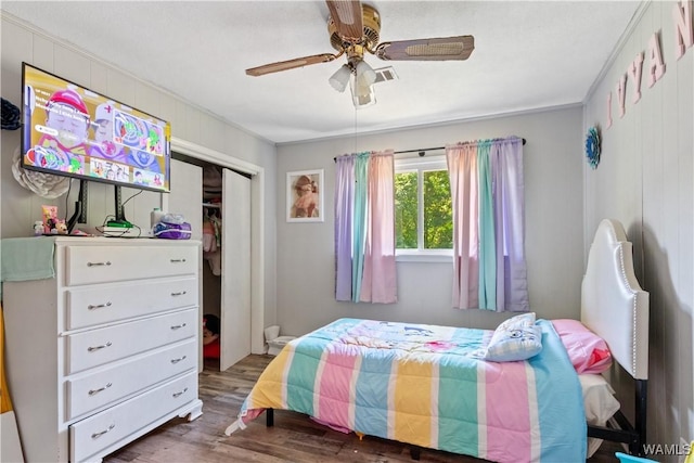 7665 Baptist Campground Rd, Northport, AL 35473 - bedroom featuring wood finished floors, a closet, ornamental molding, and ceiling fan
